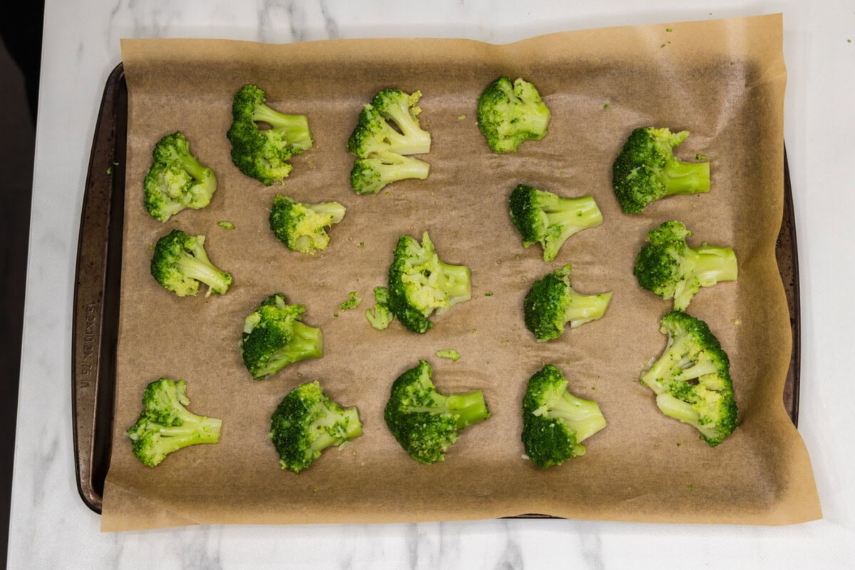 broccoli florets on a baking sheet