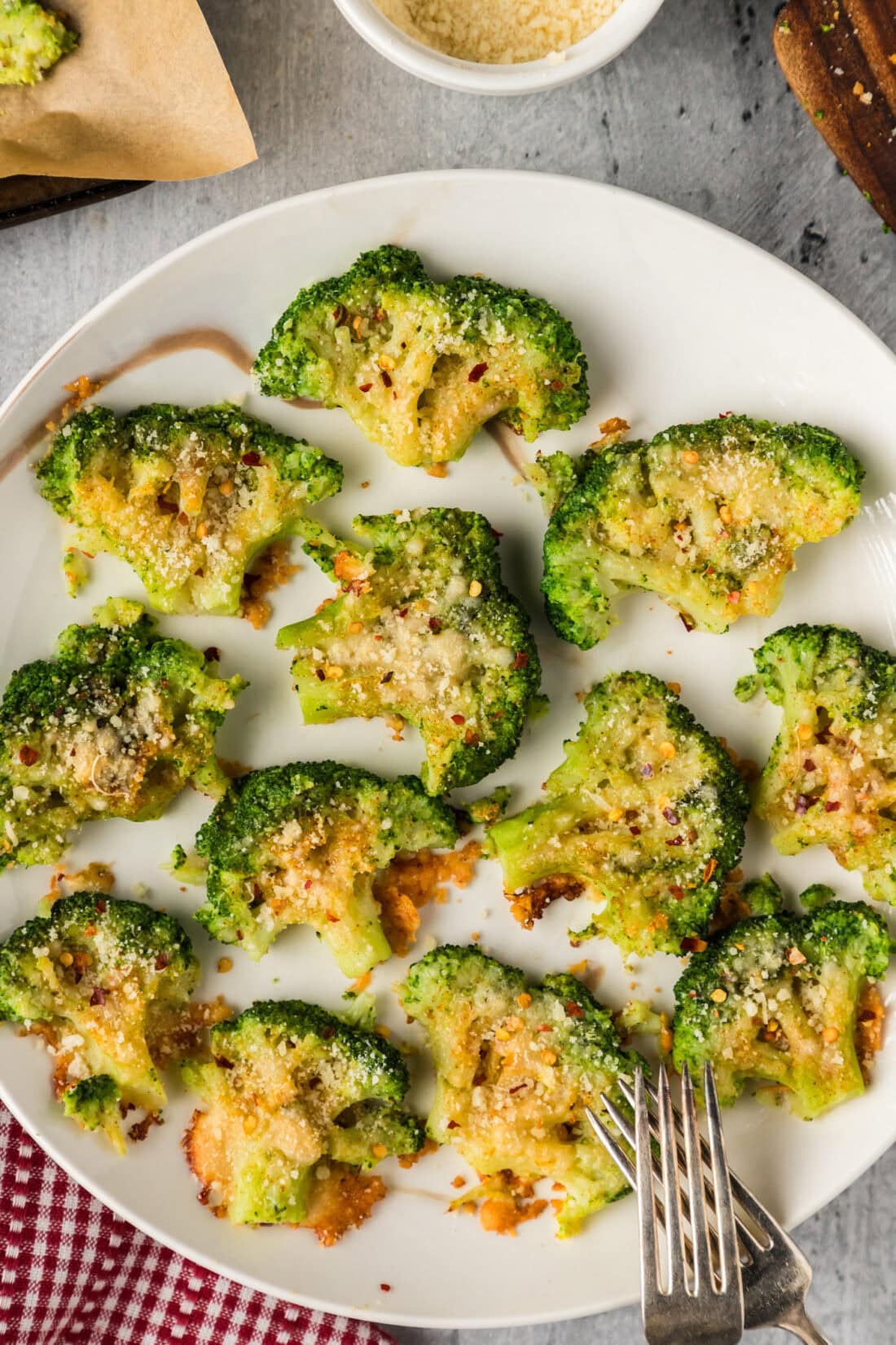 Smashed Broccoli on a plate with forks