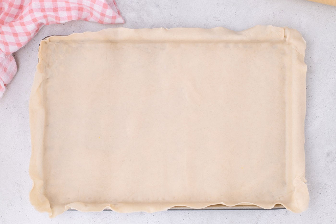 pie crust placed in a jelly roll pan