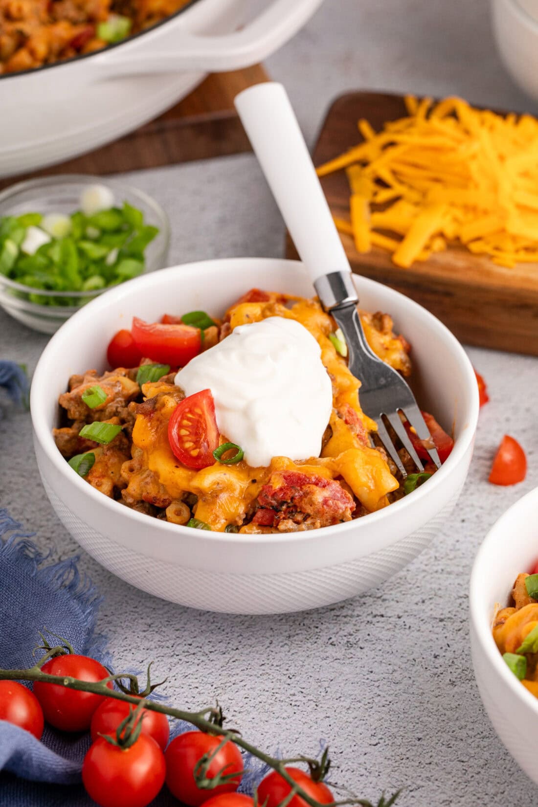 Bowl of Taco Macaroni and Cheese topped with sour cream