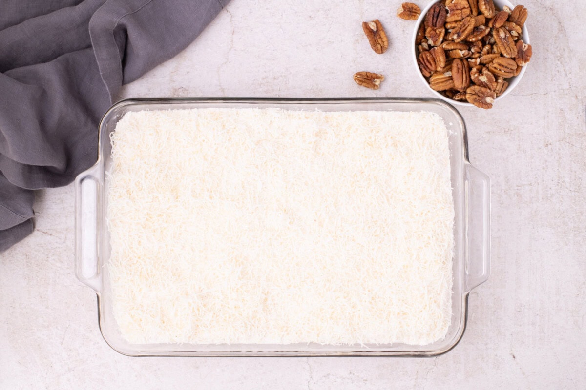 shredded coconut on top of powdered cake mix