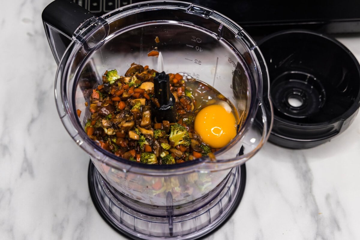 eggs and vegetable mixture in a food processor