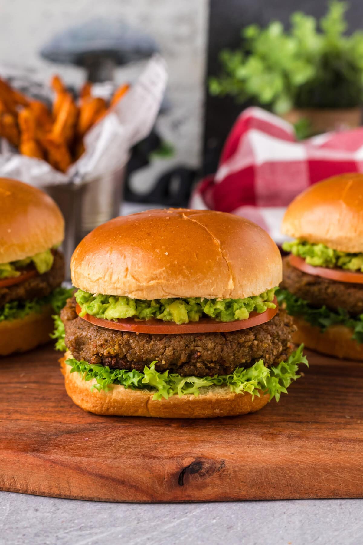 Close up photo of a Veggie Burger with more in the background
