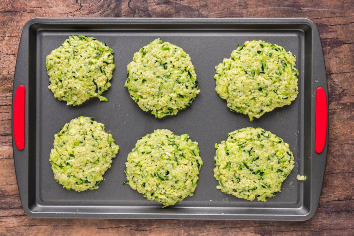 zucchini fritters on a baking sheet