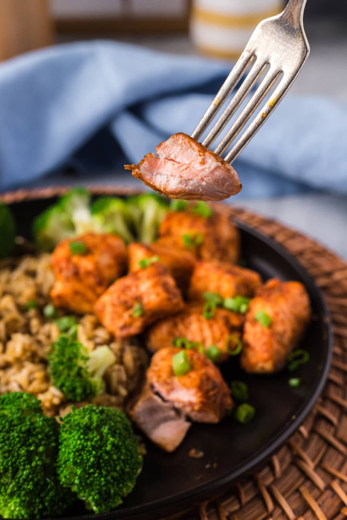 Air Fryer Salmon Bite on a fork with a bite taken out