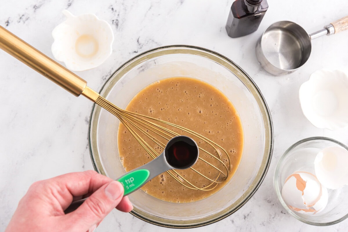adding vanilla to wet ingredients for banana upside down muffins
