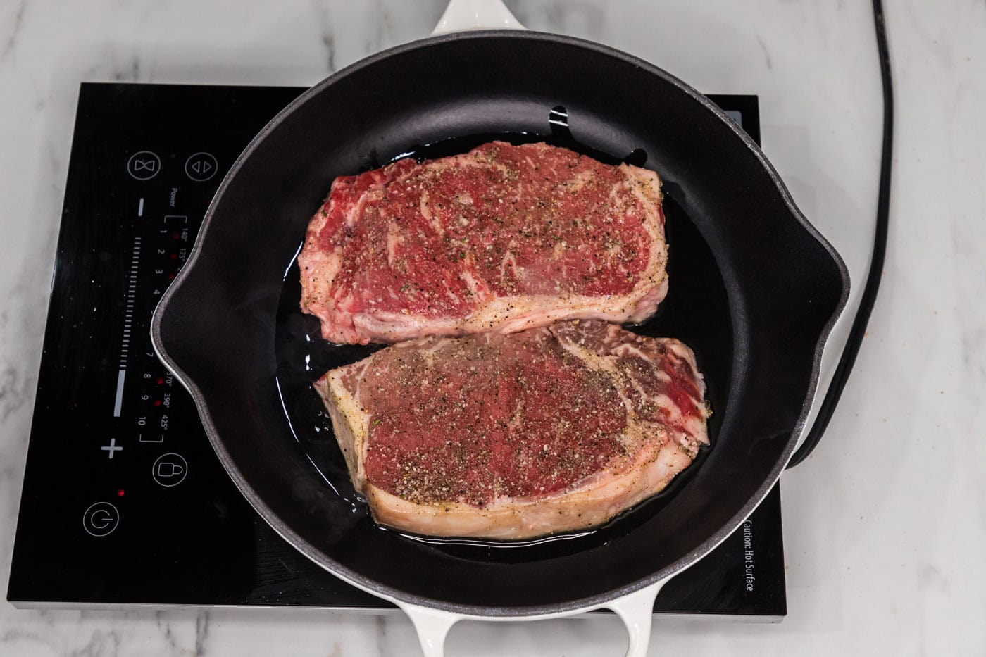 searing new york strip in a skillet
