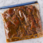Close up photo of steak and Bourbon Marinade in a ziptop bag
