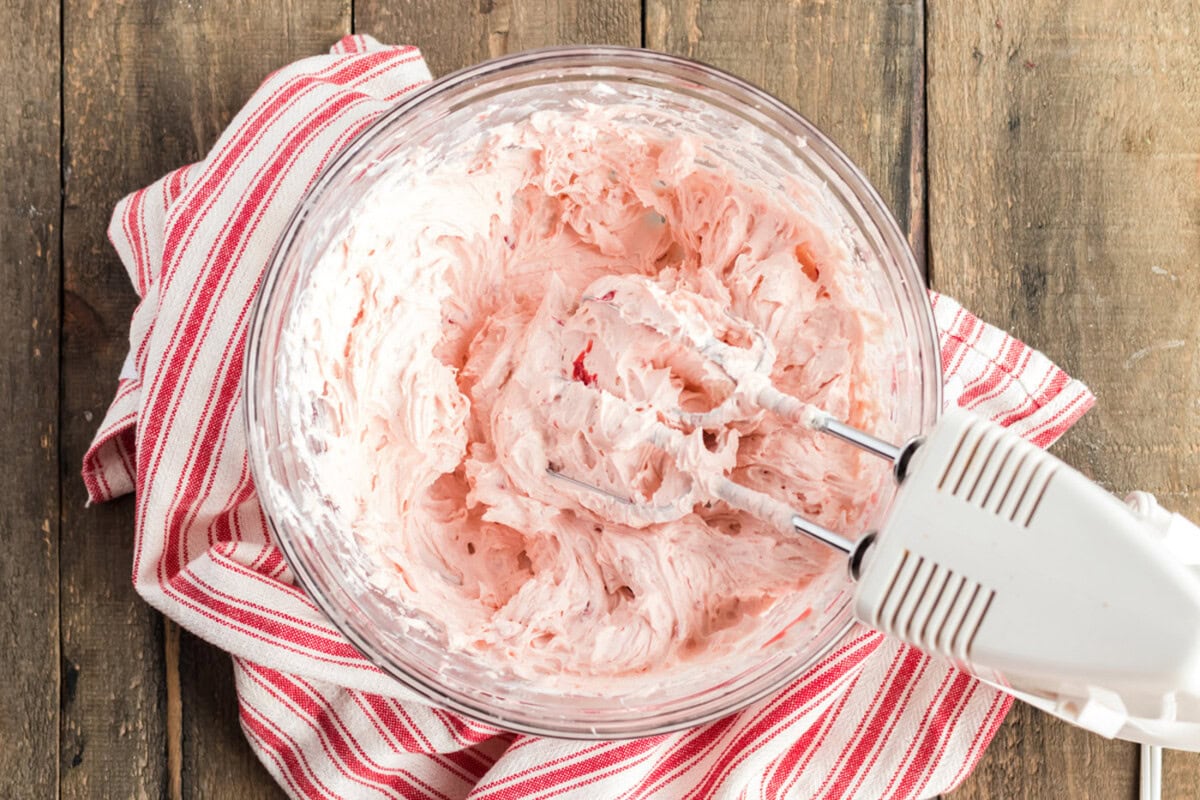 cherry pie filling and both extracts mixed into the cream cheese and butter mixture