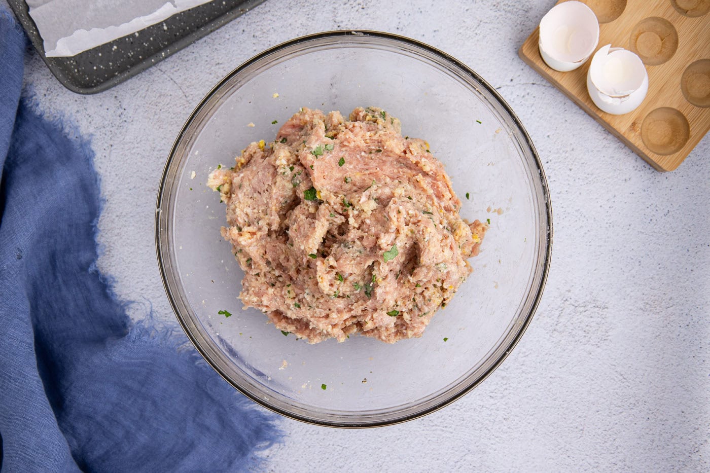 chicken meatball mixture in a mixing bowl