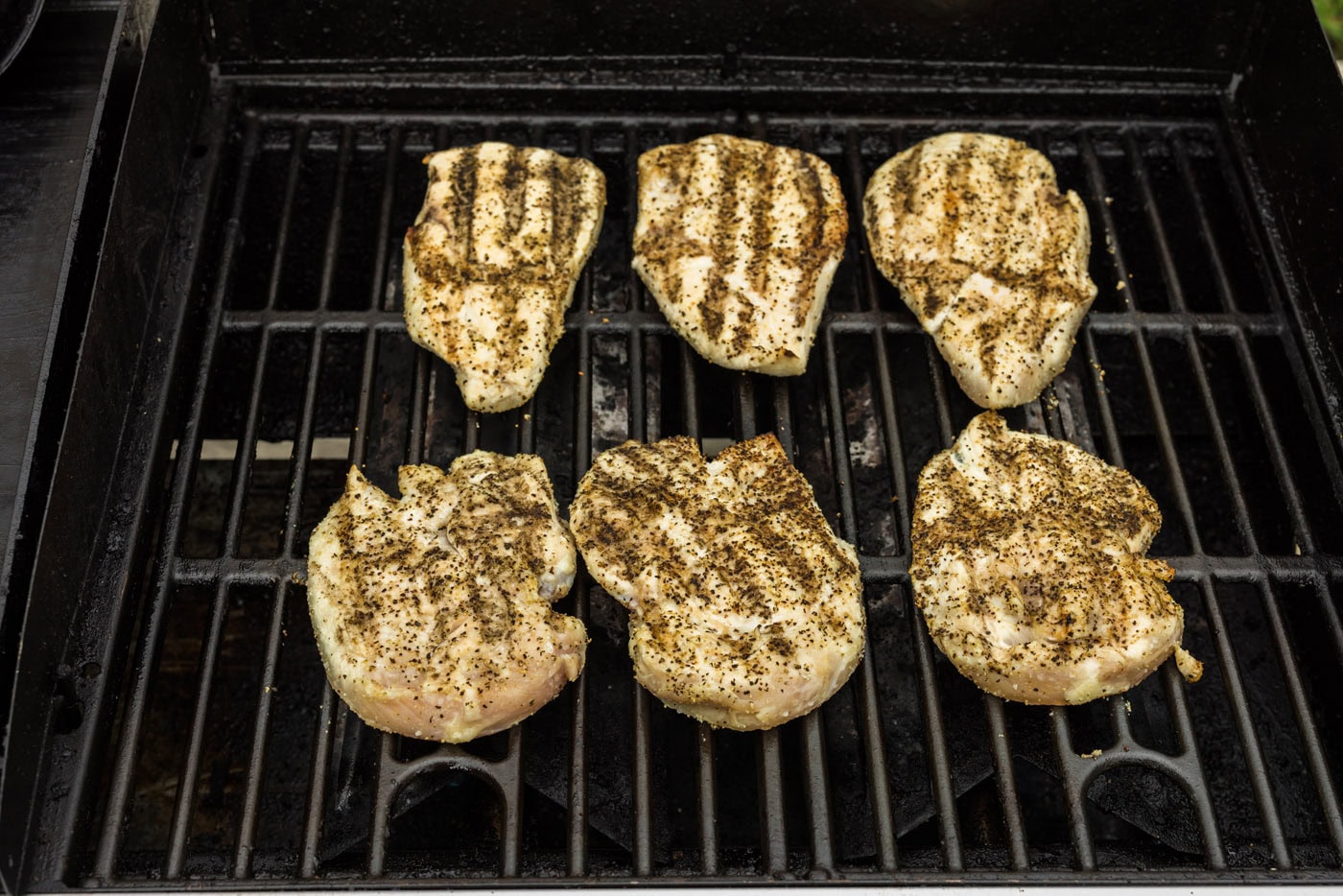 chicken breast with grill marks on a grill grate