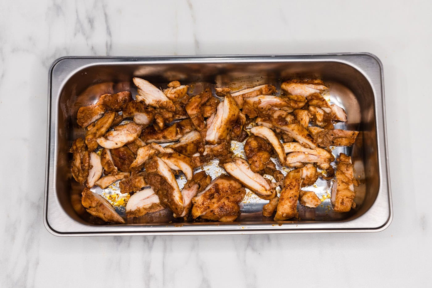 sliced chicken in a pan