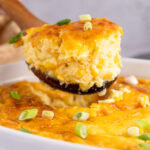 Close up photo of a scoop of Corn Pudding