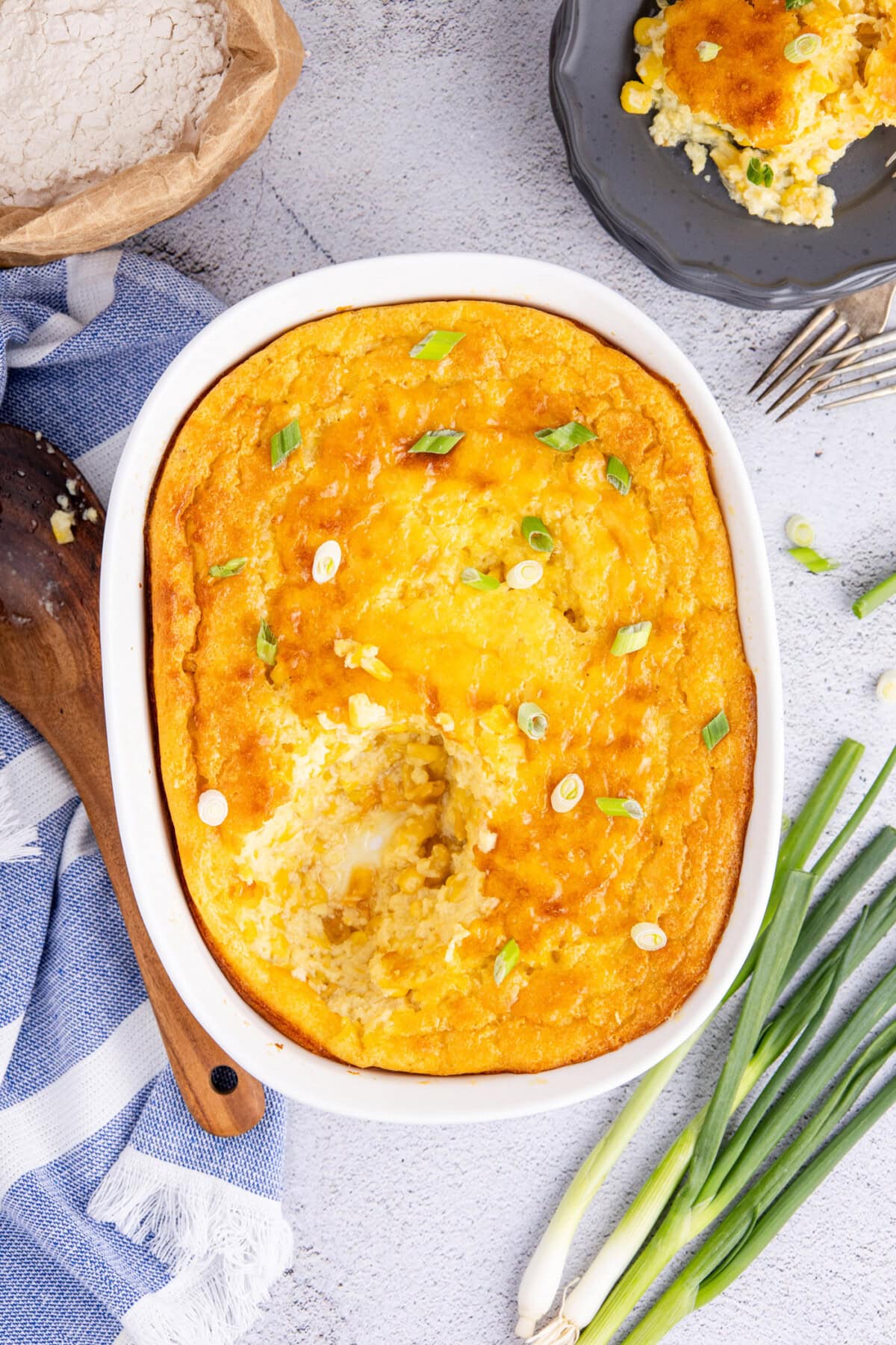 Corn Pudding in a baking dish with a serving removed