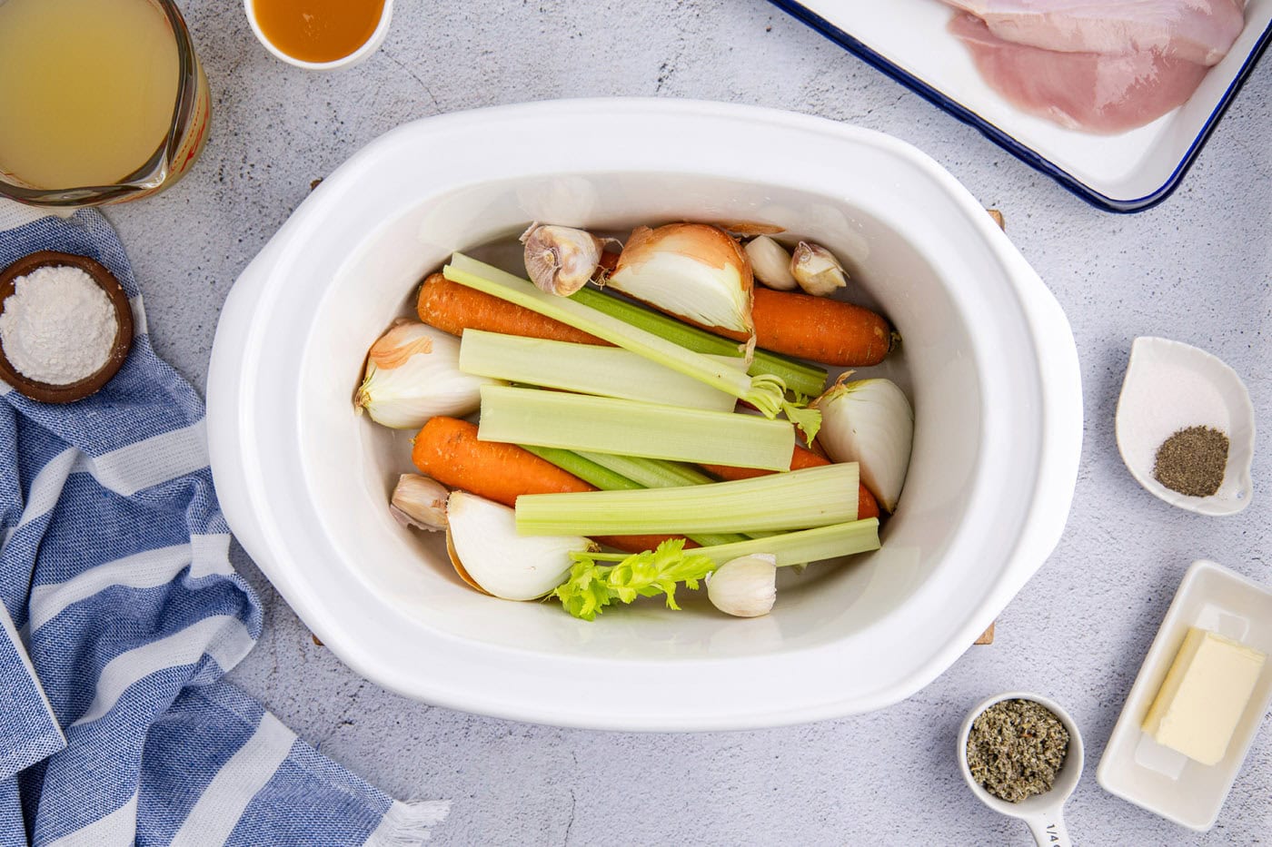 celery, onion, and carrots in a crockpot