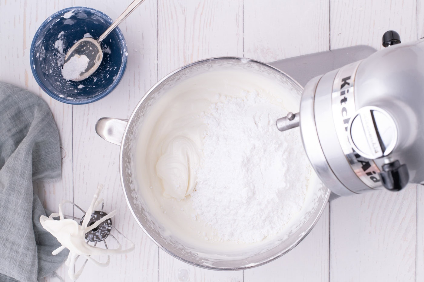 heavy cream, cream cheese, vanilla, and powdered sugar added to a stand mixer bowl