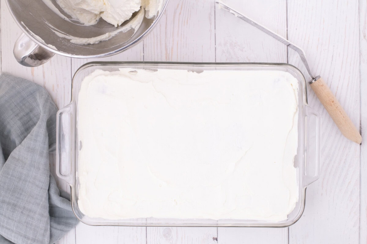whipped cream layer over nutter butter cookies in a dish