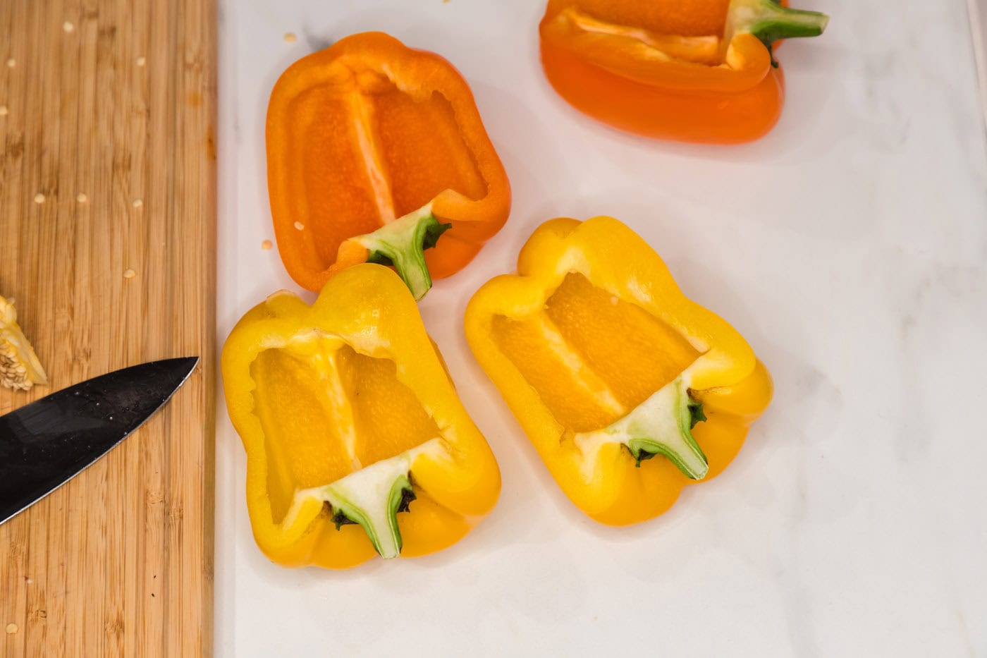 hollowed out orange and yellow bell peppers