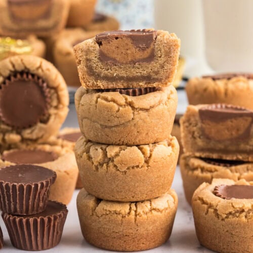 Half of a Reese’s Peanut Butter Cup Cookie stacked on top of three Reese’s Peanut Butter Cup Cookies