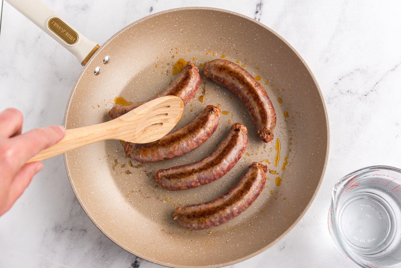 browned Italian sausage in a skillet