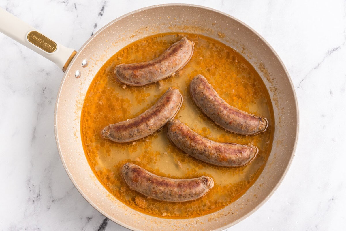 water added to skillet with Italian sausage