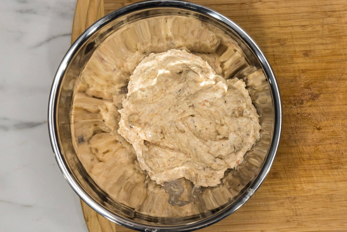 blended shrimp mixture added to bread crumbs in a bowl