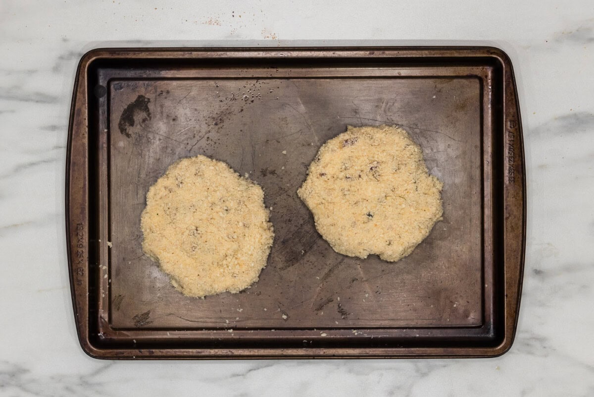 shrimp burger patties on a baking sheet