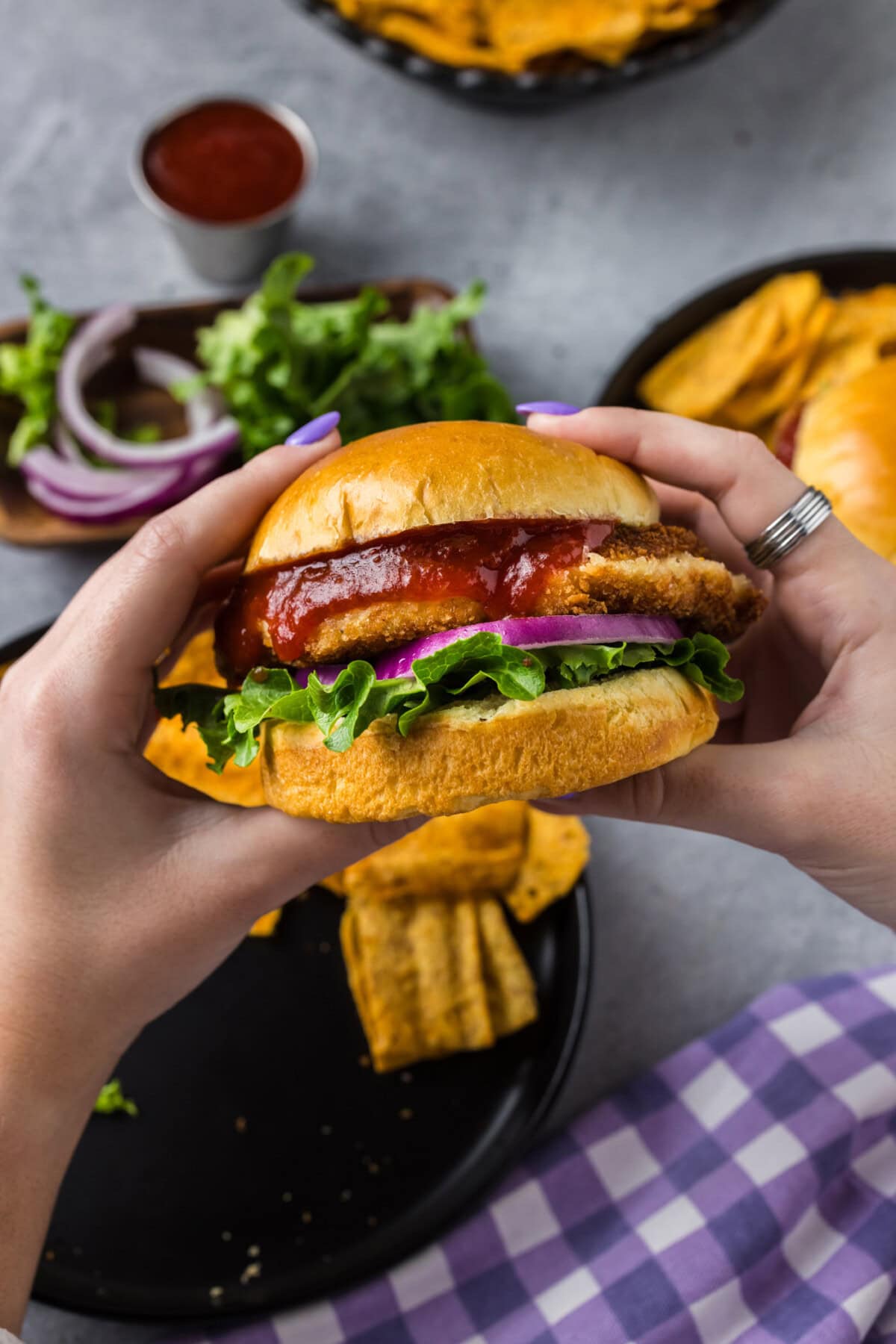 Hands holding up a Shrimp Burger