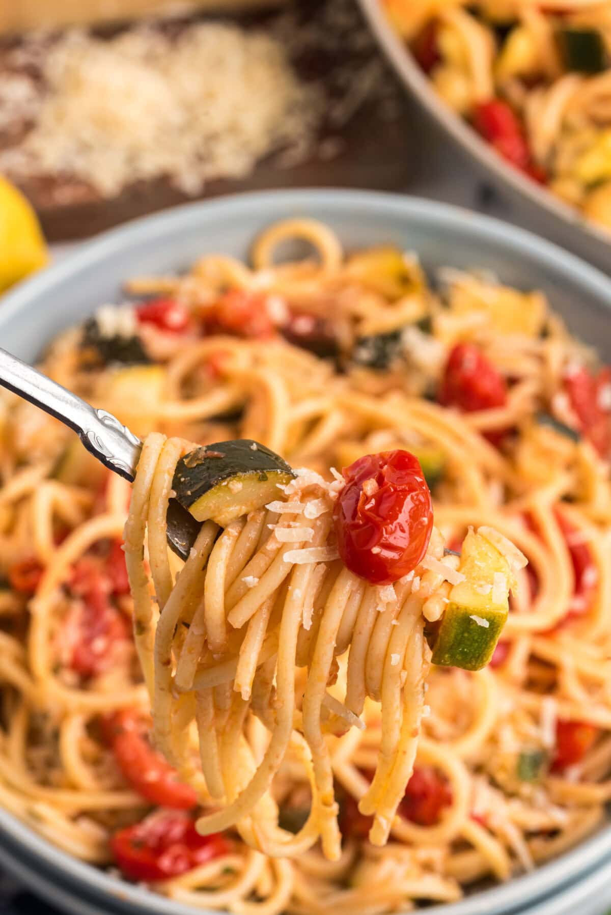 Simple Zucchini Tomato Pasta twisted on a fork