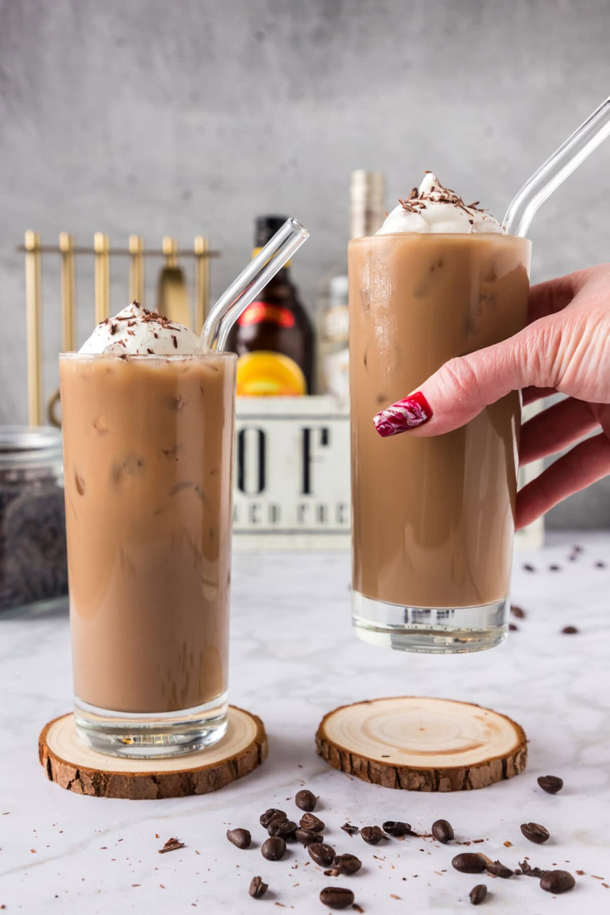 Hand holding up a Spiked Iced Coffee