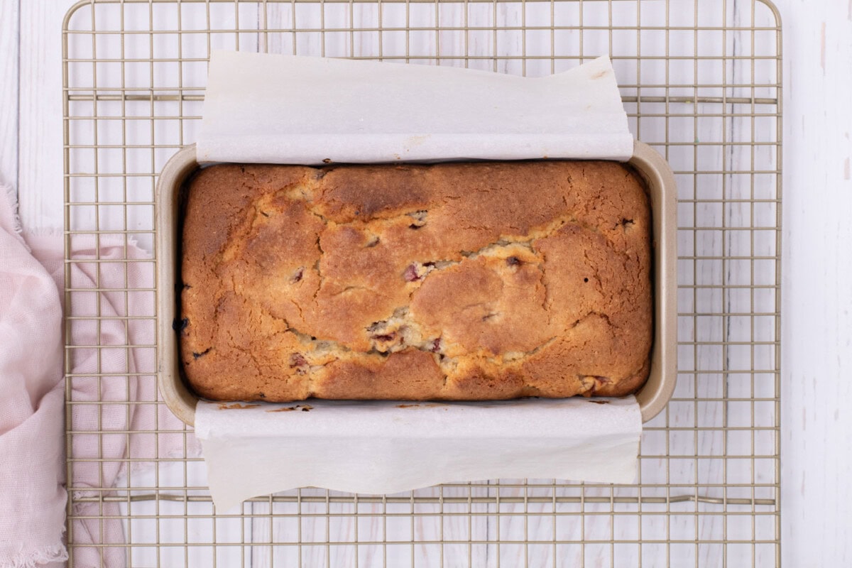 baked strawberry pound cake overhead on a cooling rack
