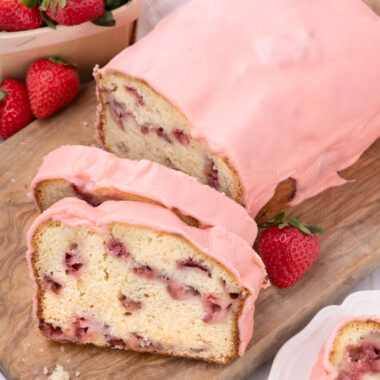 Strawberry Pound Cake with two slices on a wood board