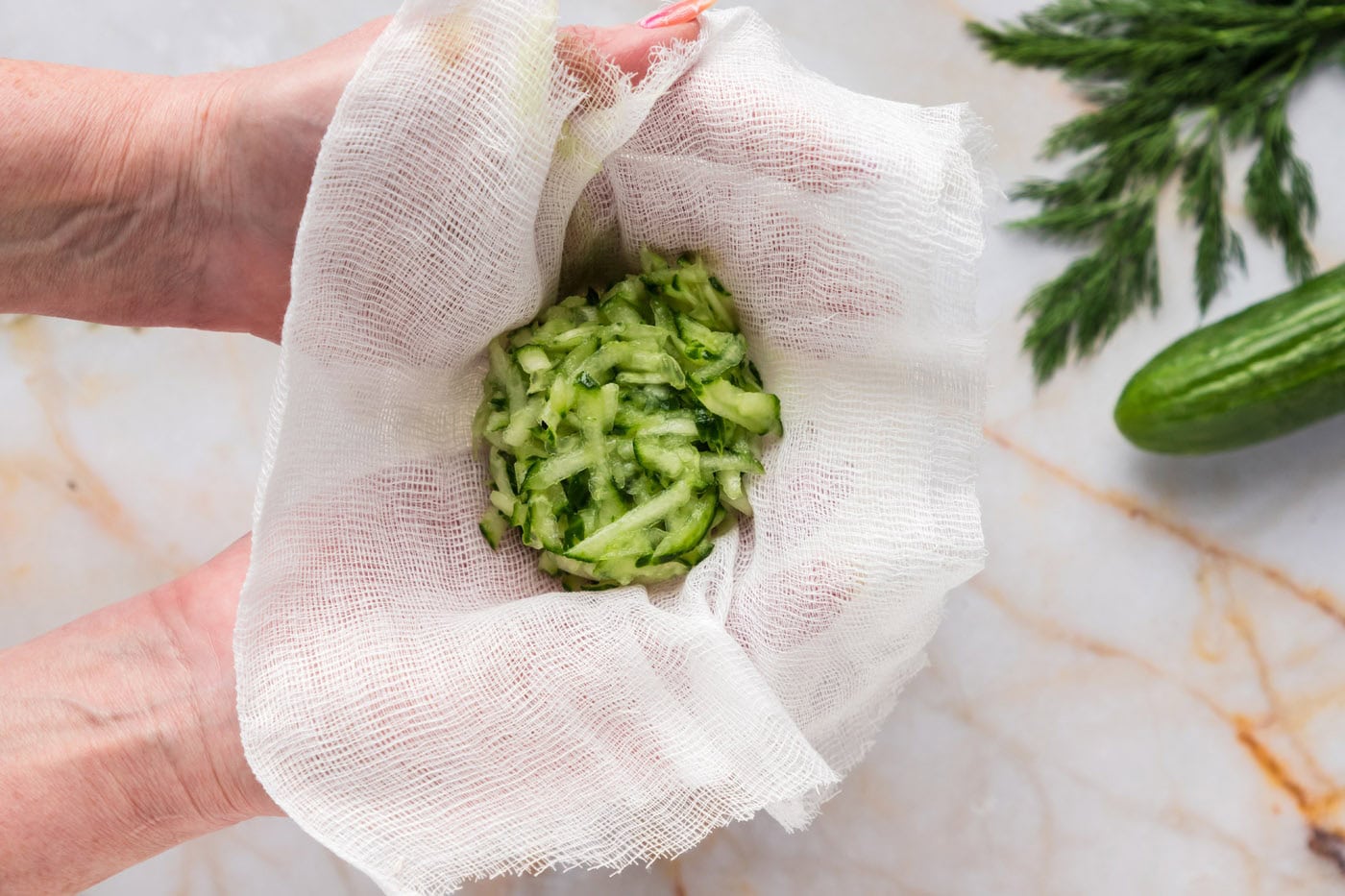 shredded cucumber in a cheesecloth