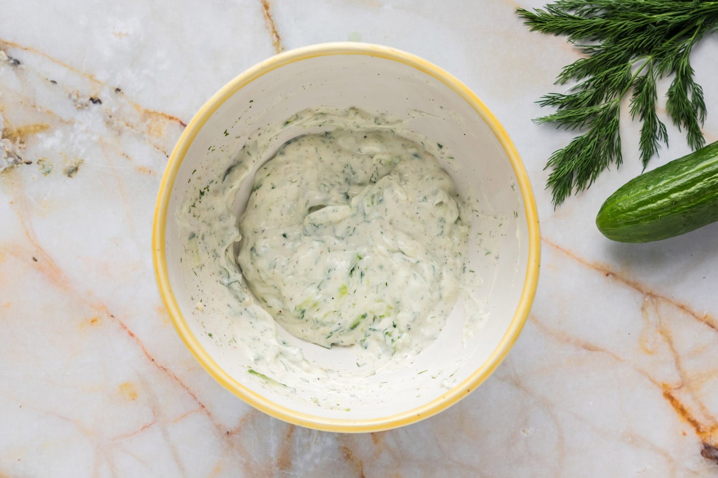 tzatziki sauce combined in a mixing bowl
