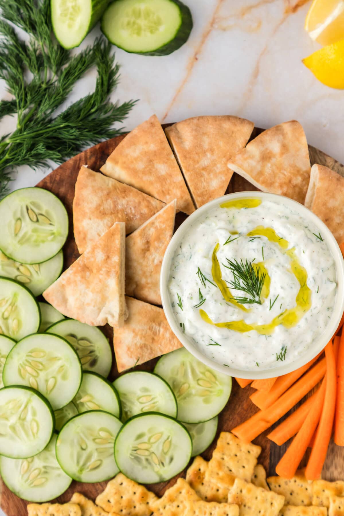Close up photo of a bowl of Tzatziki Sauce topped with olive oil
