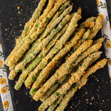 Air Fryer Fried Asparagus stacked up on a platter