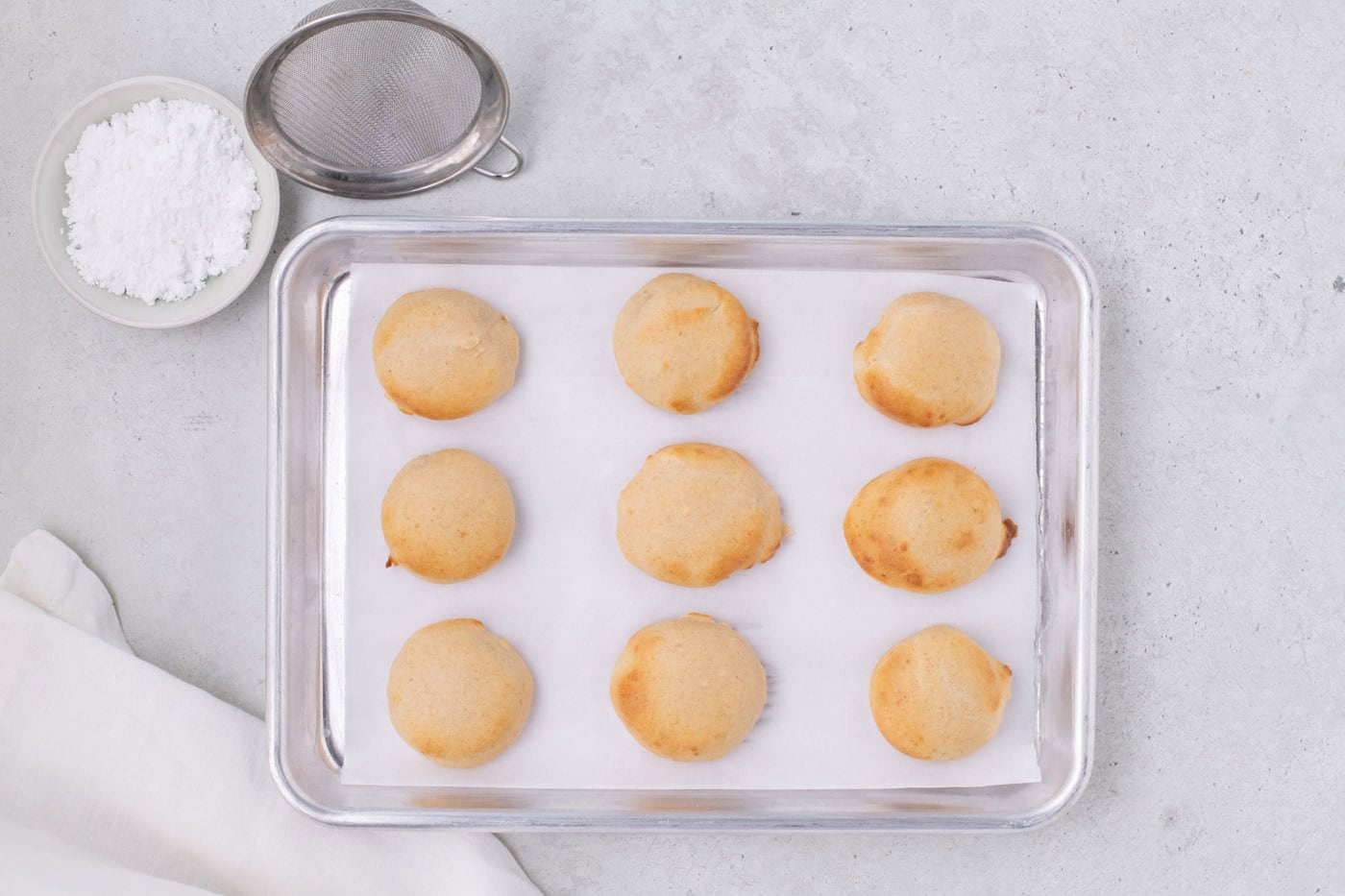 air fried Oreos on a parchment lined baking sheet