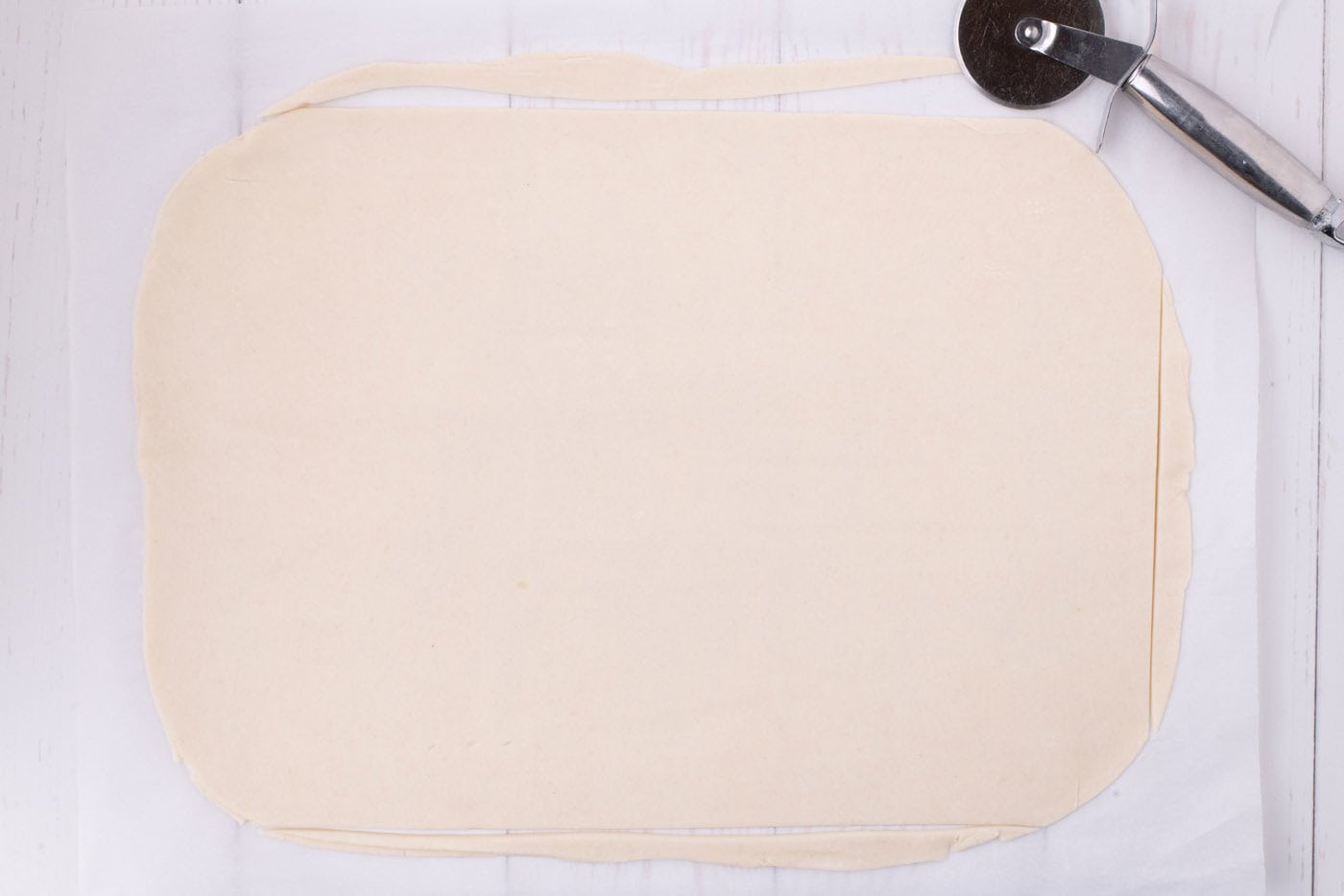 pie dough cut to length for a jelly roll pan