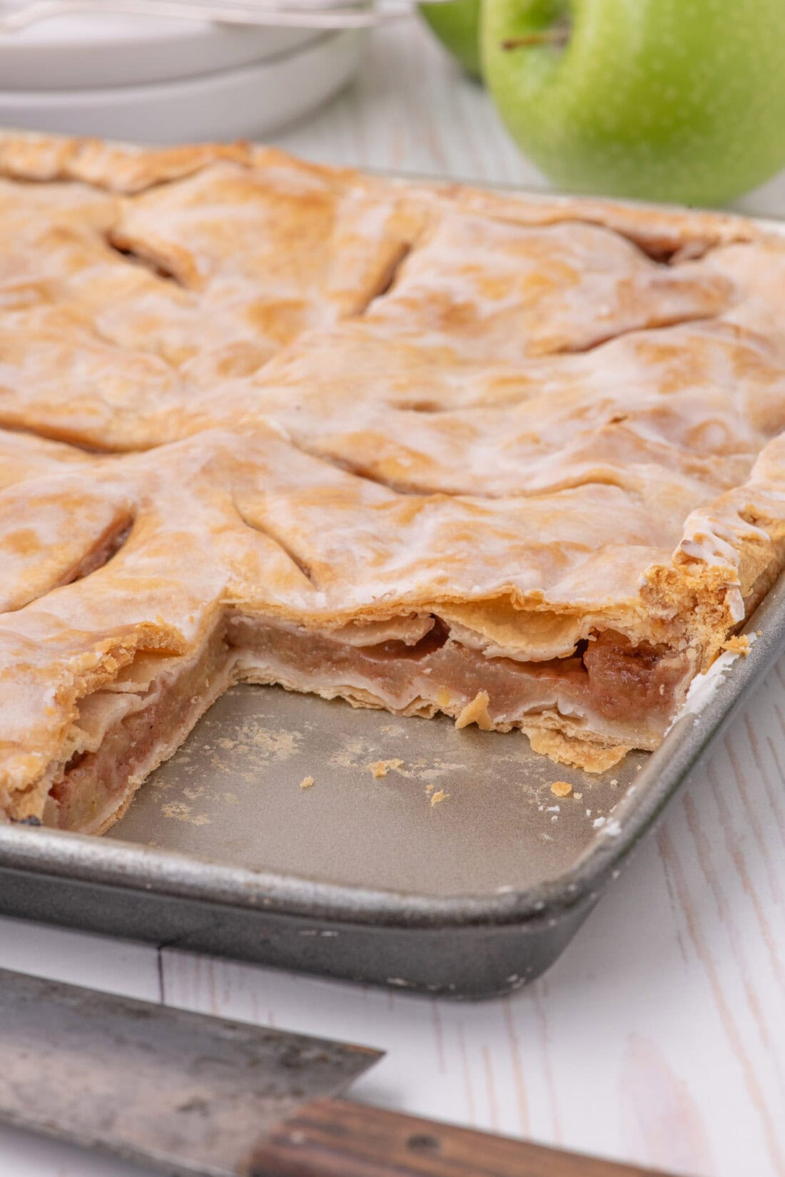 Pan of Apple Slab Pie with a slice removed