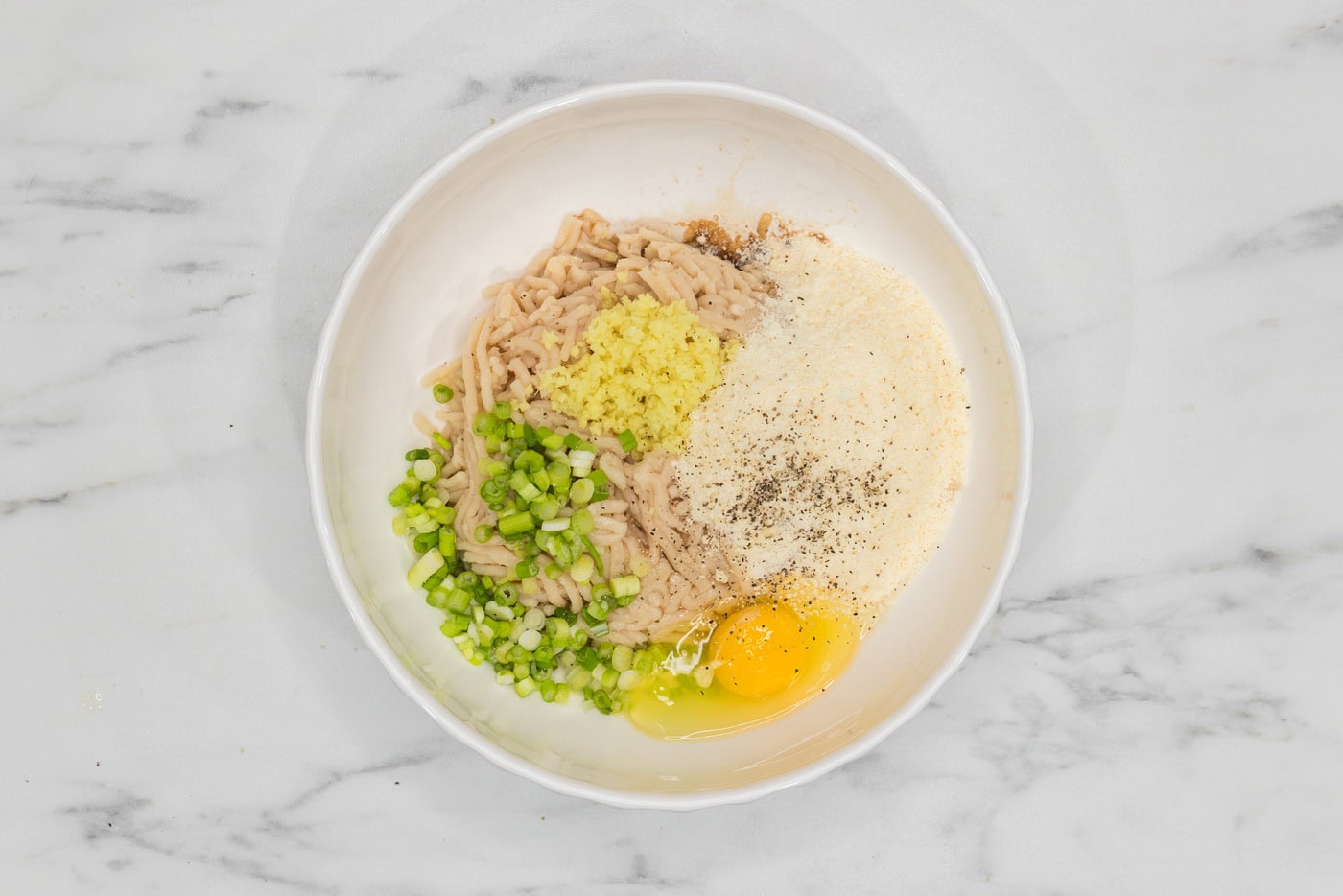 Asian meatballs mixture in a mixing bowl