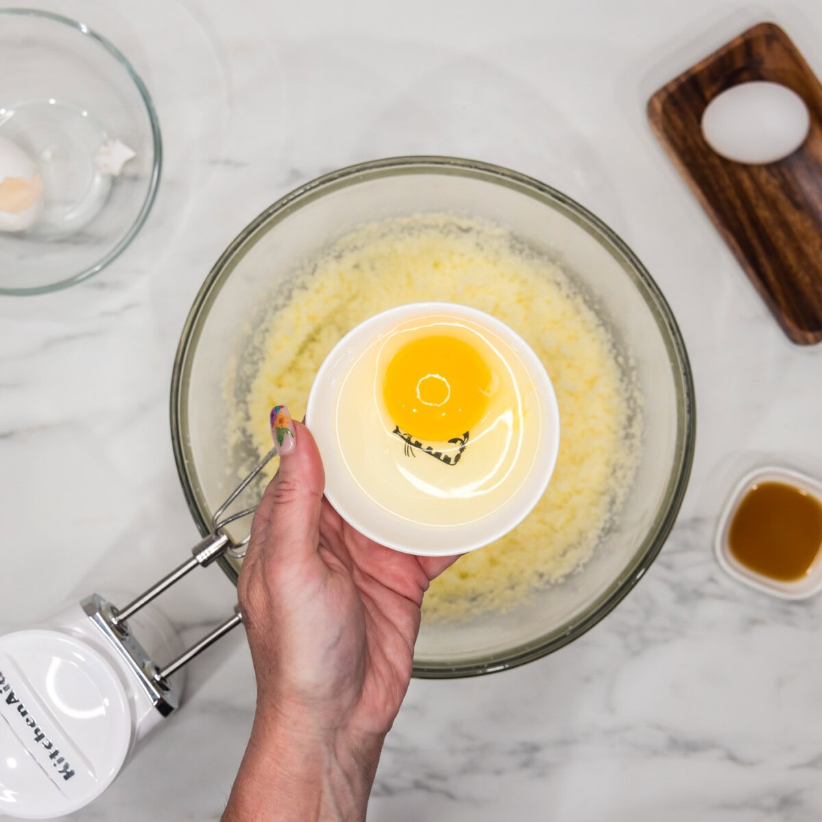 adding eggs to bundt cake batter