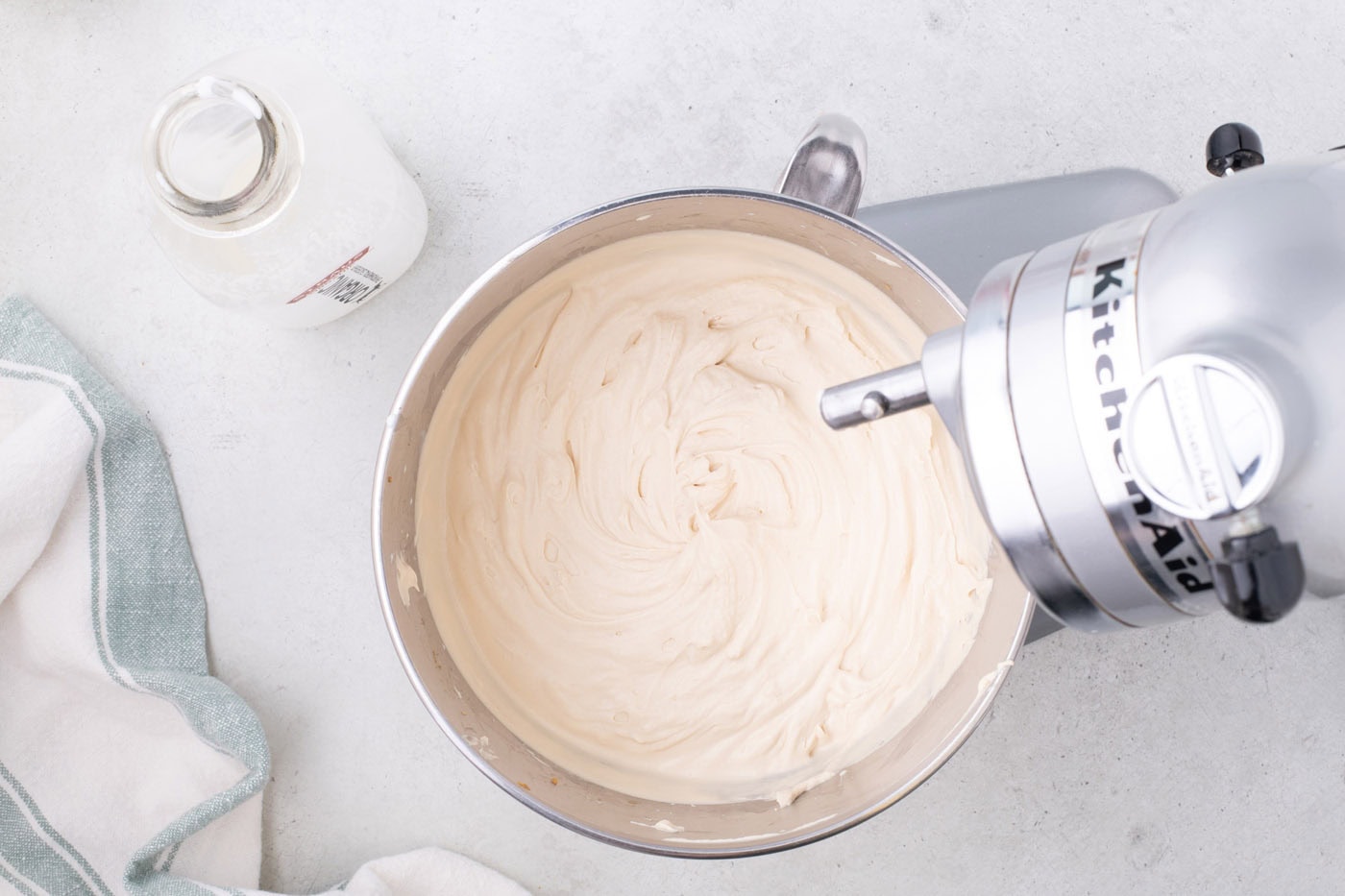 whipped cream cookie butter mixture in a stand mixer bowl