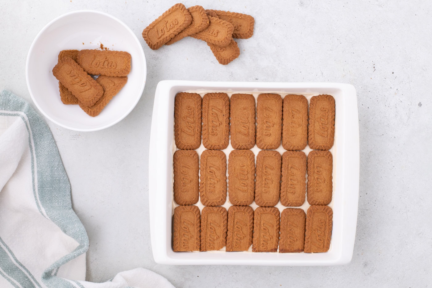 layer of Biscoff cookies over whipped cream layer