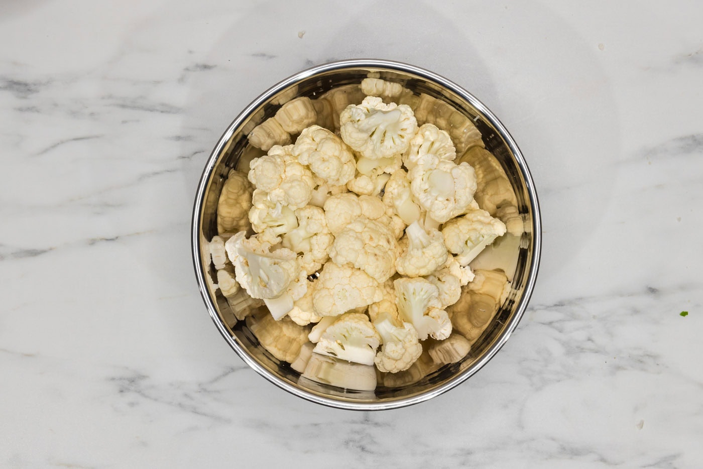 cauliflower cut into florets in a bowl