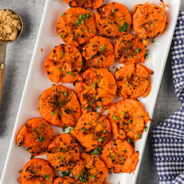 Smashed Carrots on a white platter