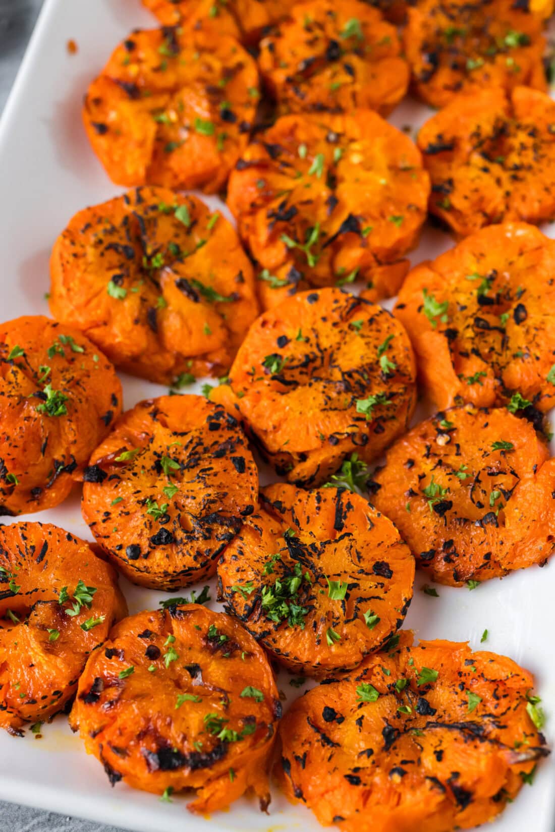 Close up photo of Smashed Carrots on a platter