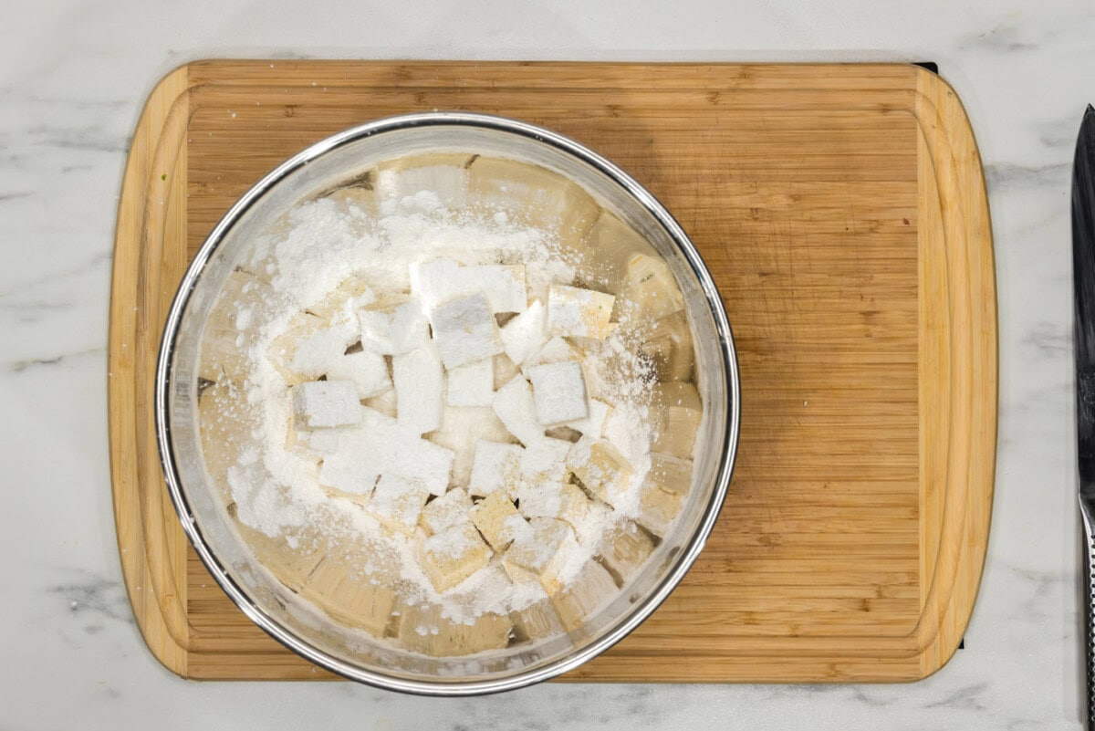 cornstarch added to bowl of tofu