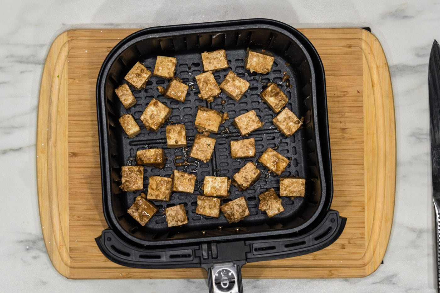 tofu in an air fryer basket