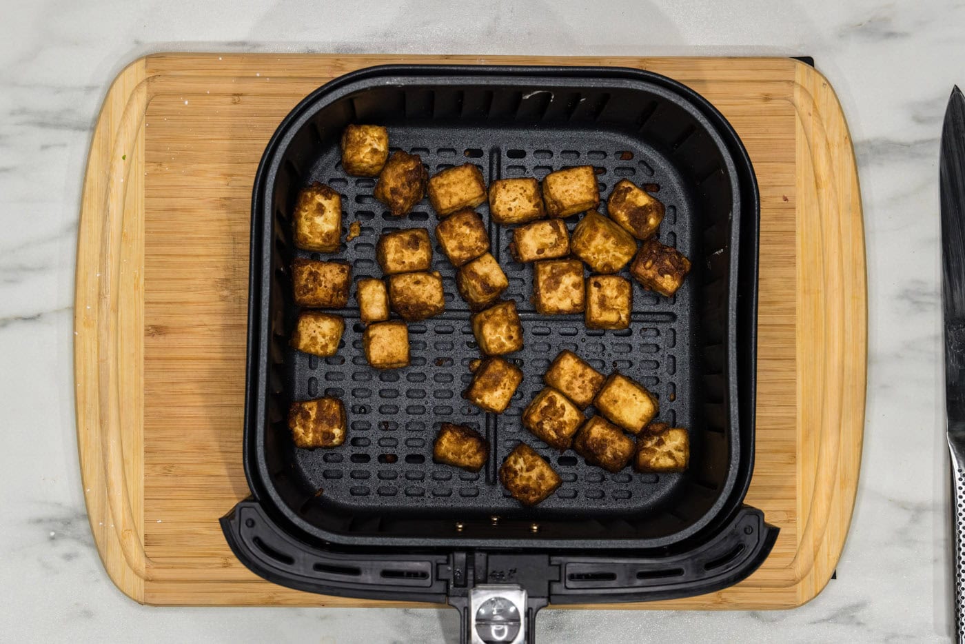 air fried tofu in air fryer basket