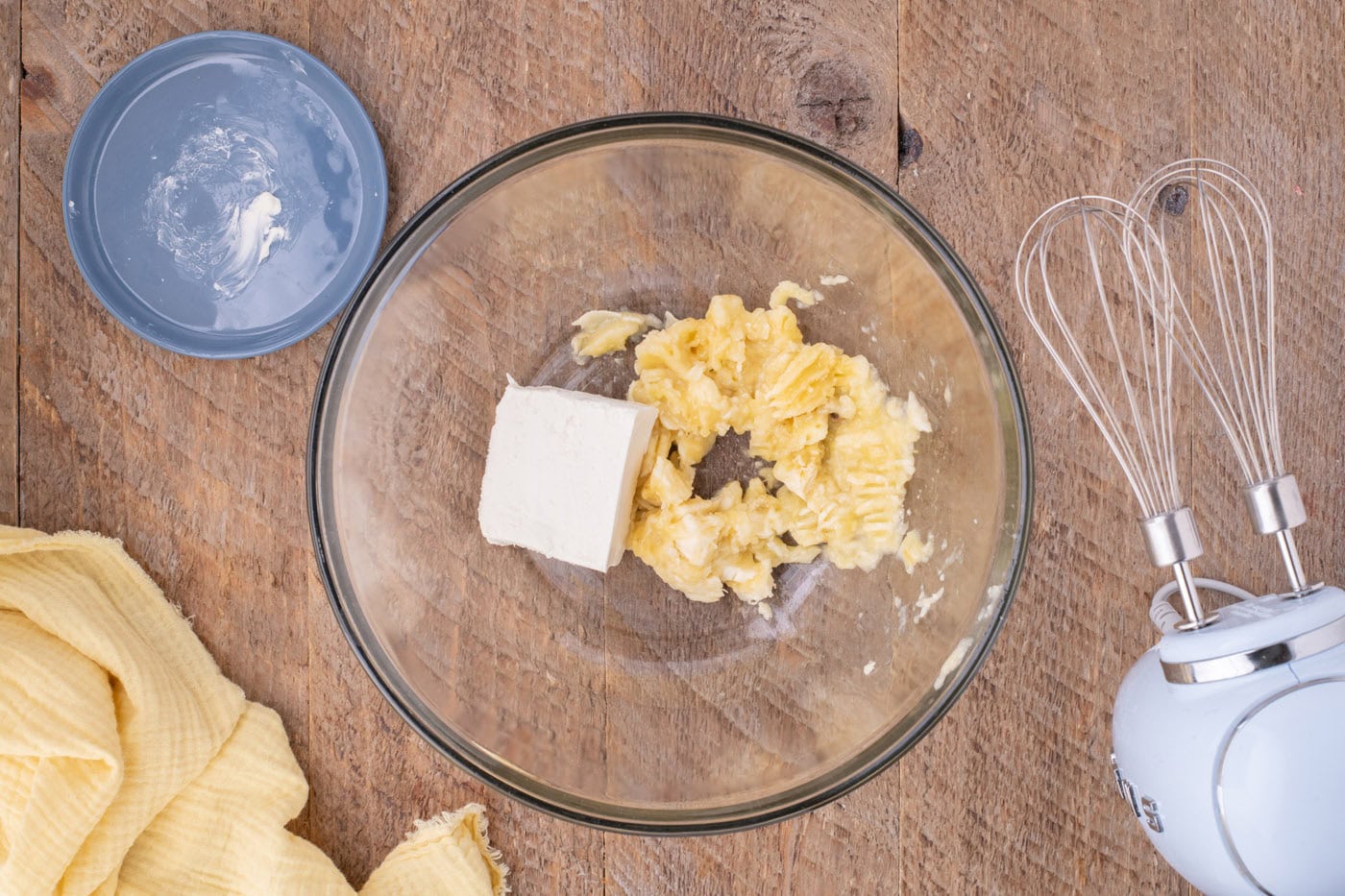 mashed bananas with cream cheese in a bowl